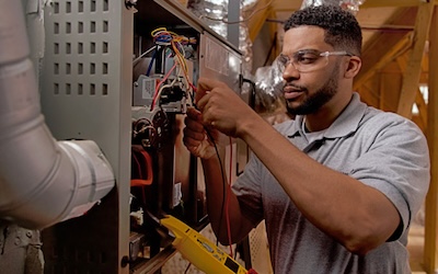 Careers-540×302-1 Technician working on HVAC unit